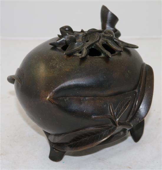 A large Chinese bronze peach-shaped censer and cover, 17th/18th century, height 17.5cm, length 21cm